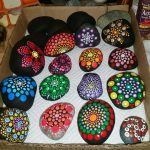 Mandala painting on a smooth river rocks